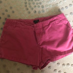 Pink J. Crew chino shorts.